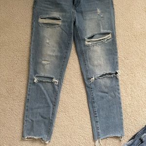 Distressed straight legged jeans